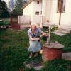 Malvina posing at the well in the backyard of the house.  This was a new well from her times