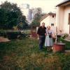 Malvina with the neighbor posing in the backyard of her house