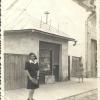 Malvina next to the store that she and Irwin used.  Irwin was a watchmaker and Malvina was a milliner.  The sign says,  "Izak Grunfeld, Hodinar"  (Izak, her brother Irwin, Hodinar is watchmaker)