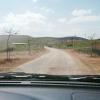 On top of the hill, on the tree lined road, going to Maskiot